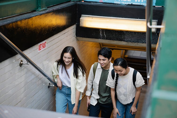 People Walking Up The Stairs Of The Subway