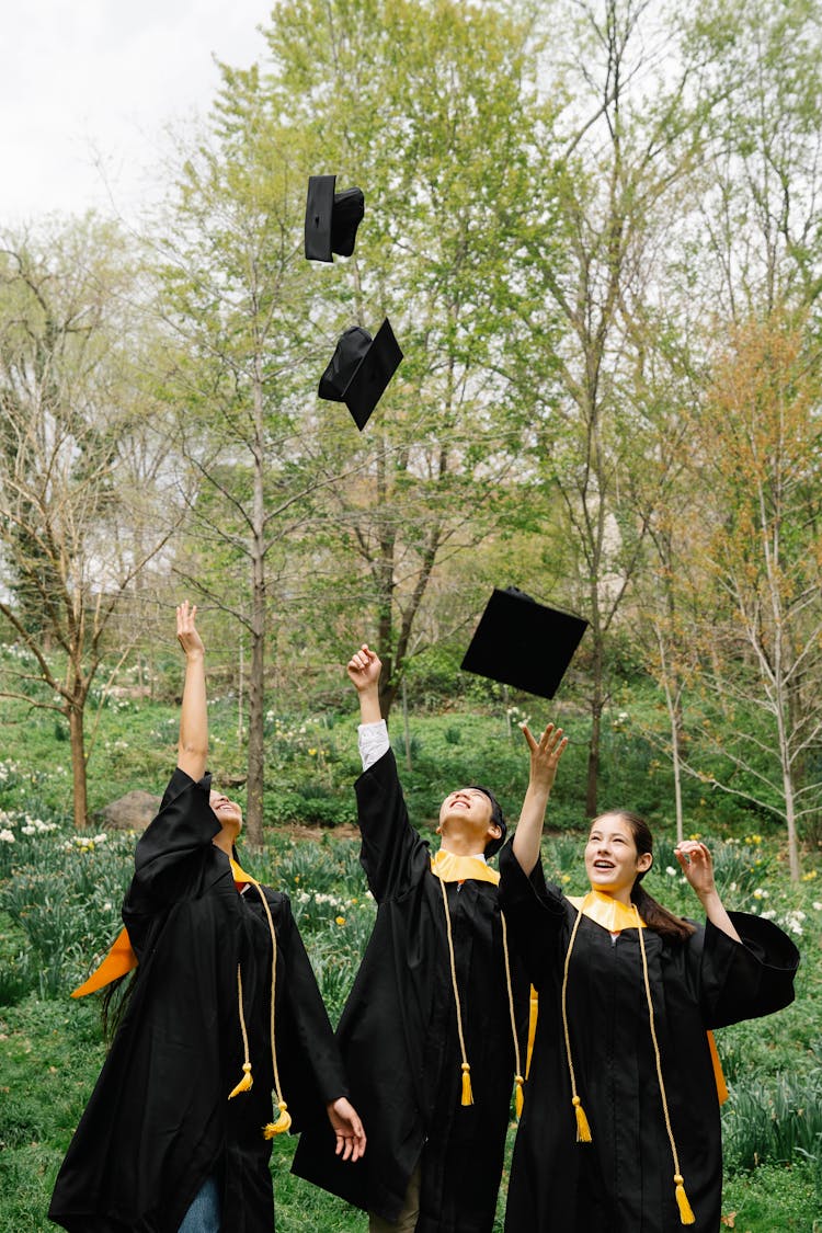 Victorious Former Students Threw Their Graduation Caps 