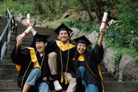 Graduates Holding their Diplomas