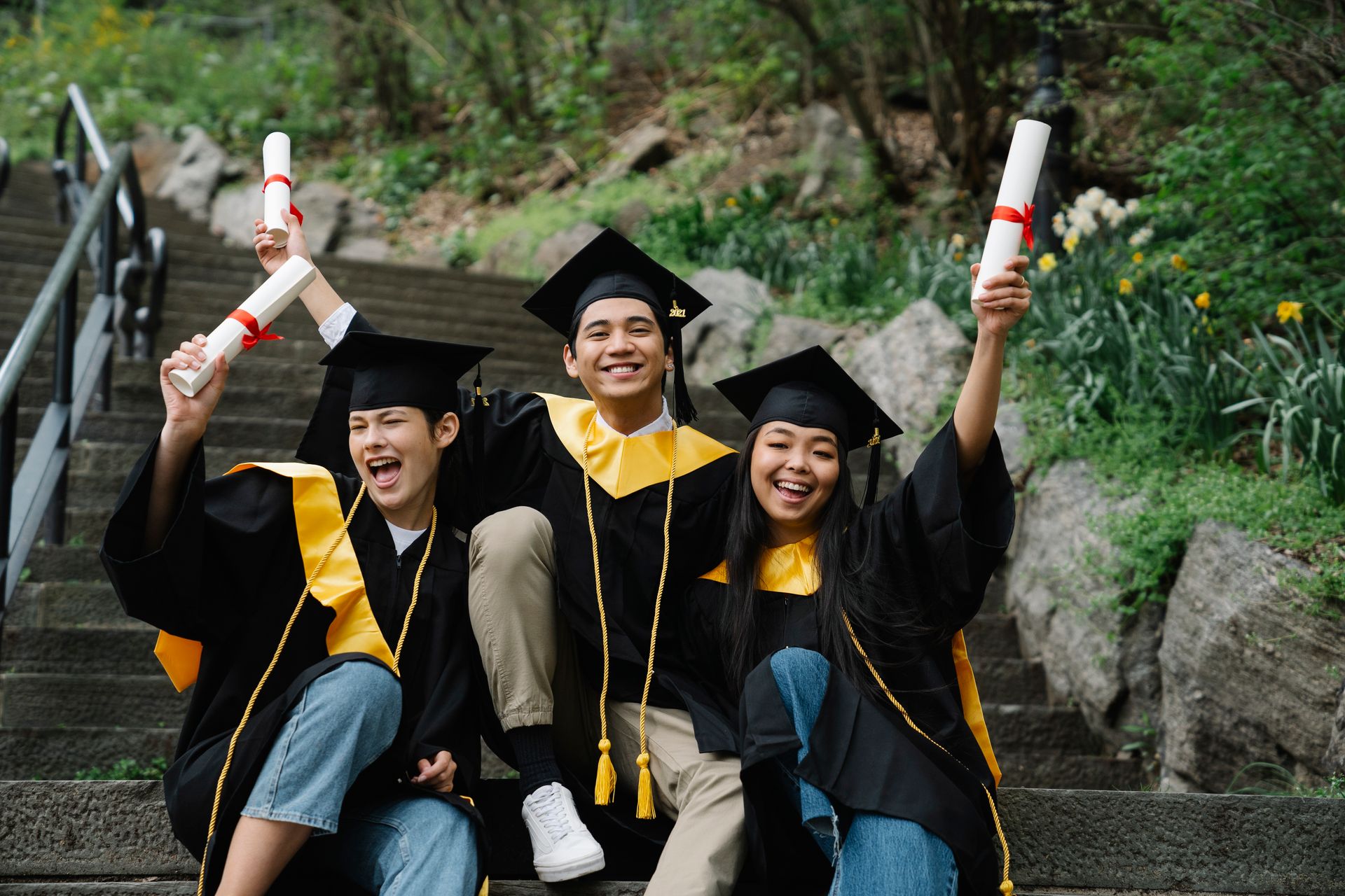 Graduates Holding their Diplomas