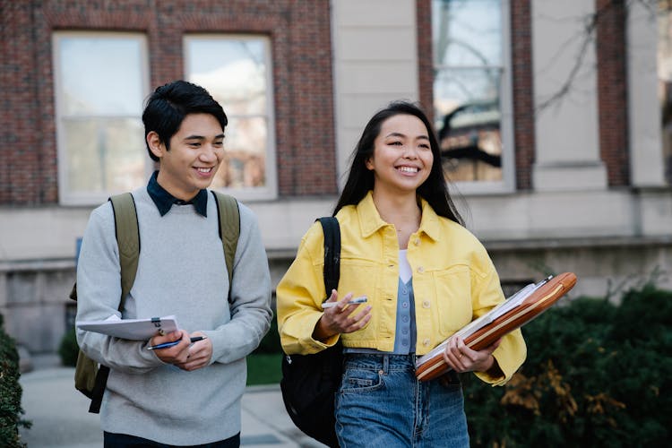 Young Man And Woman Walking Together 