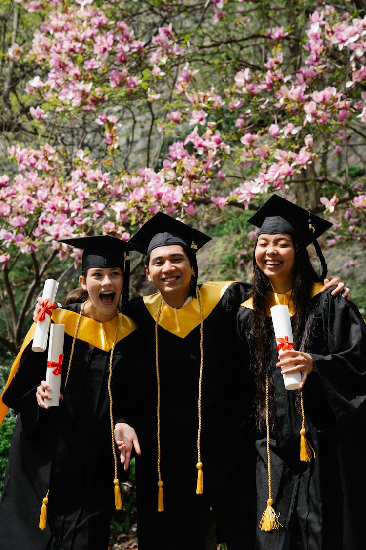 Young Achievers In Their Graduation Toga