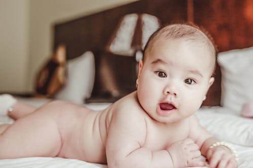 Free Baby on the Bed Stock Photo
