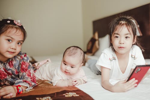 Free Kids on the Bed Stock Photo