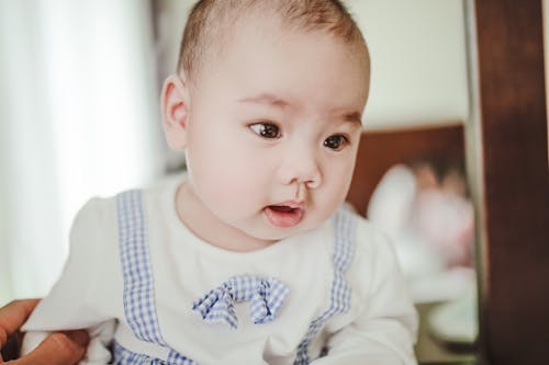 Free Baby Wearing White and Blue Clothing Stock Photo