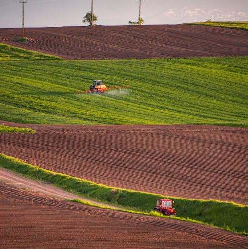 Photo of a Tractor Spraying on Crops