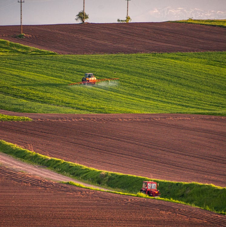 Photo of a Tractor Spraying on Crops