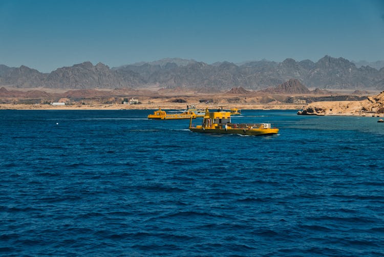 Yellow Watercrafts Against The Background Of Mountains And The Sea In Ras Mohammed National Park, Egypt