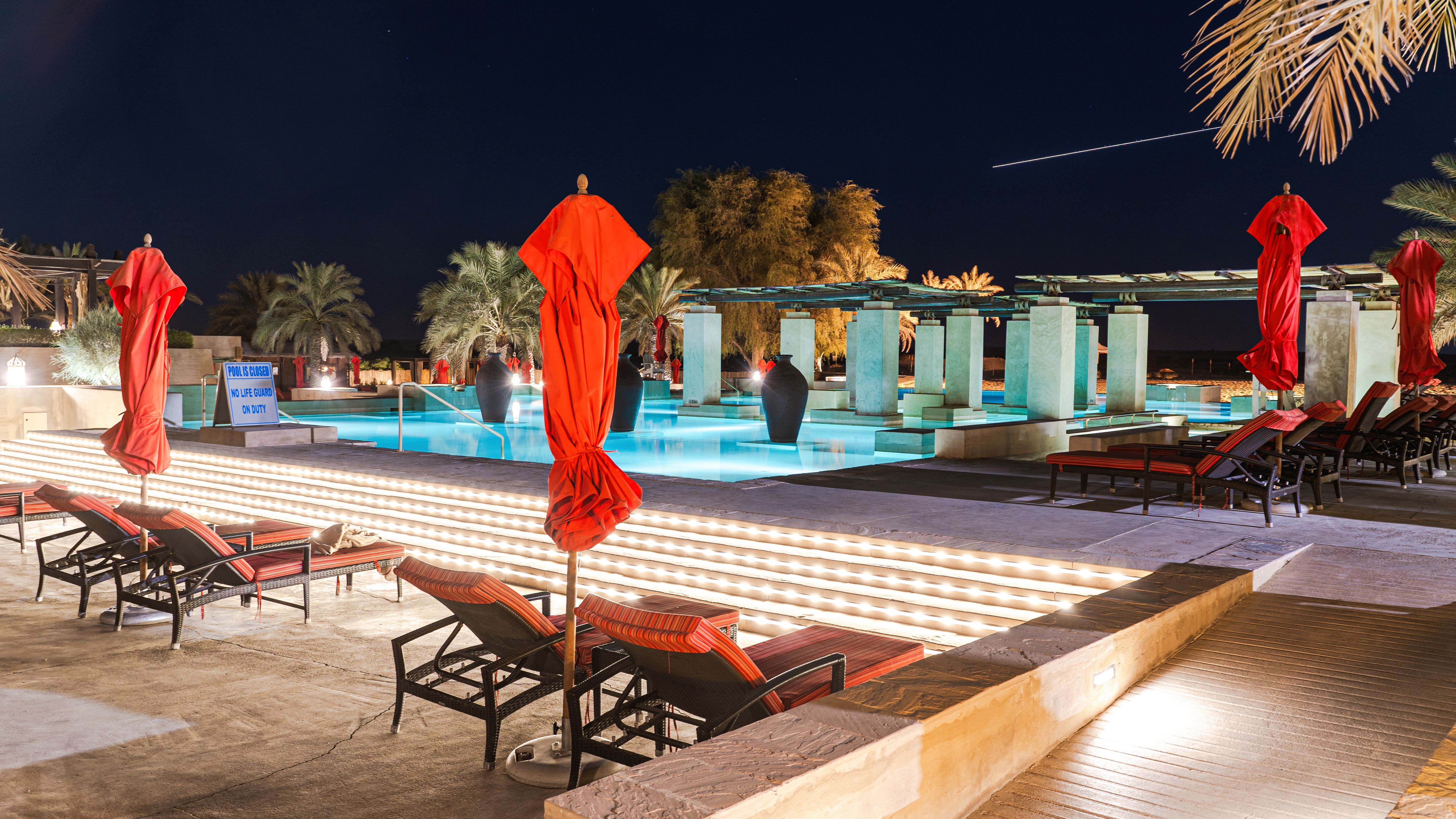 Illuminated Swimming Pool Area During Night Time · Free Stock Photo