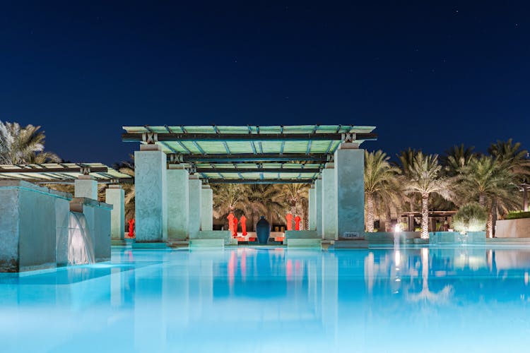 A Swimming Pool Of A Hotel At Night