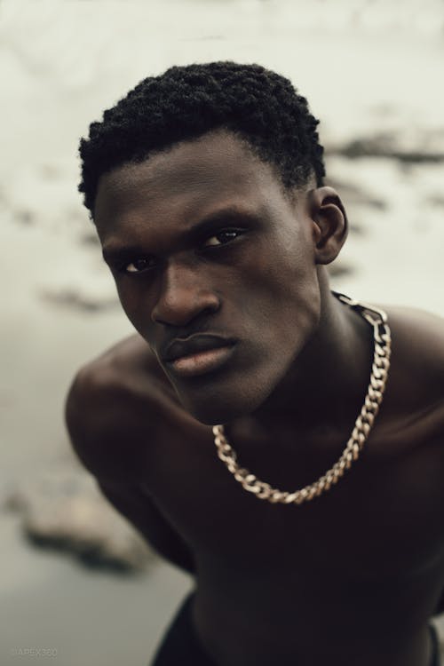 Portrait of a Topless Man Wearing a Gold Chain Necklace