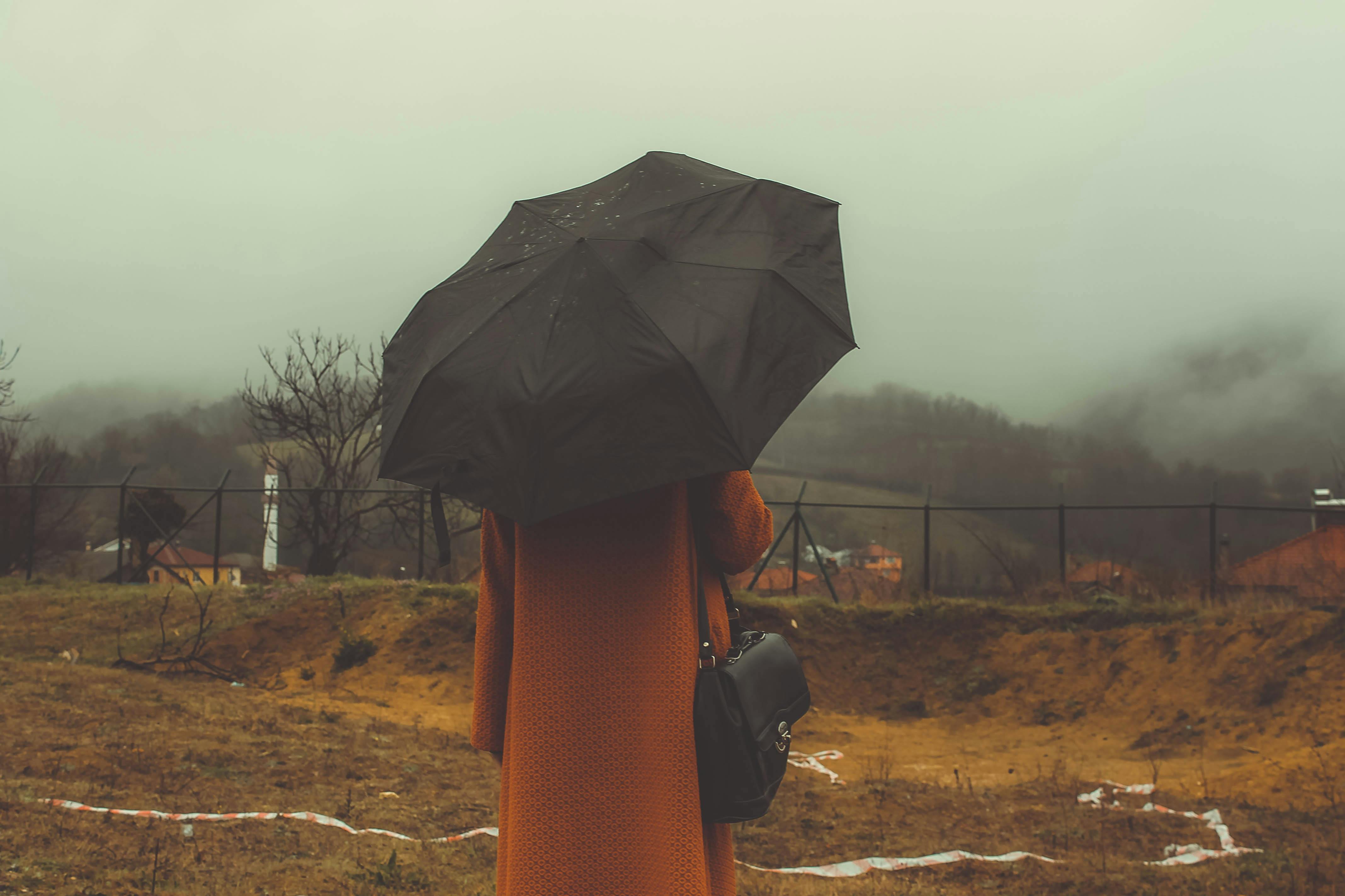 Photo of Woman Standing Wearing Black Jacket Near Mountain · Free Stock ...