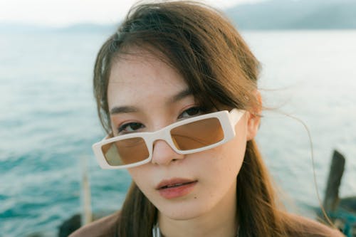 Close-Up Shot of a Woman Wearing White Sunglasses