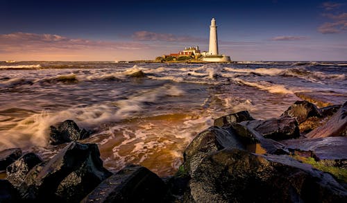 Foto profissional grátis de beira-mar, crepúsculo, farol