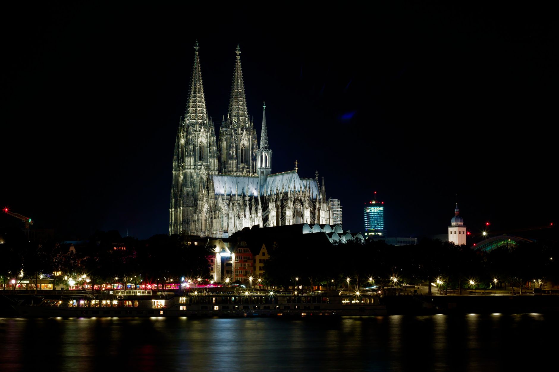 Cologne cathedral museum square lit up in evening