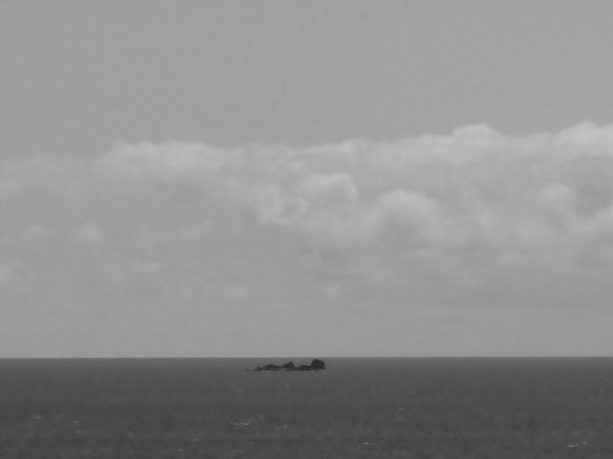 Silhouetted couple walking at sunset representing a private relationship