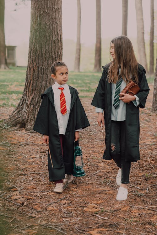 Free Two Girls Wearing Harry Potter Costumes Stock Photo