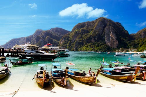 Yellow Wooden Boat Dock on White Sand Beach