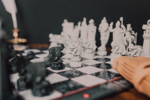 Intricate chess pieces inspired by wizarding themes on a chessboard.