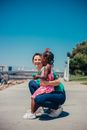 Girl Sitting on the Leg of a Woman