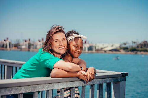 A Mother and Her Daughter Smiling