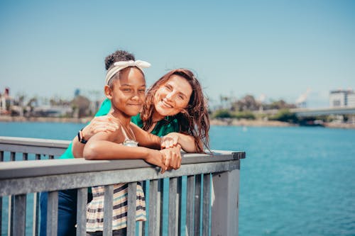 A Mother and Her Daughter Smiling