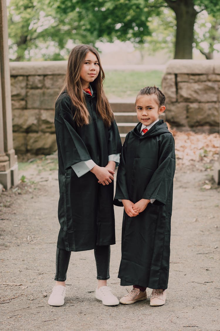 Girls In Black Robes Standing