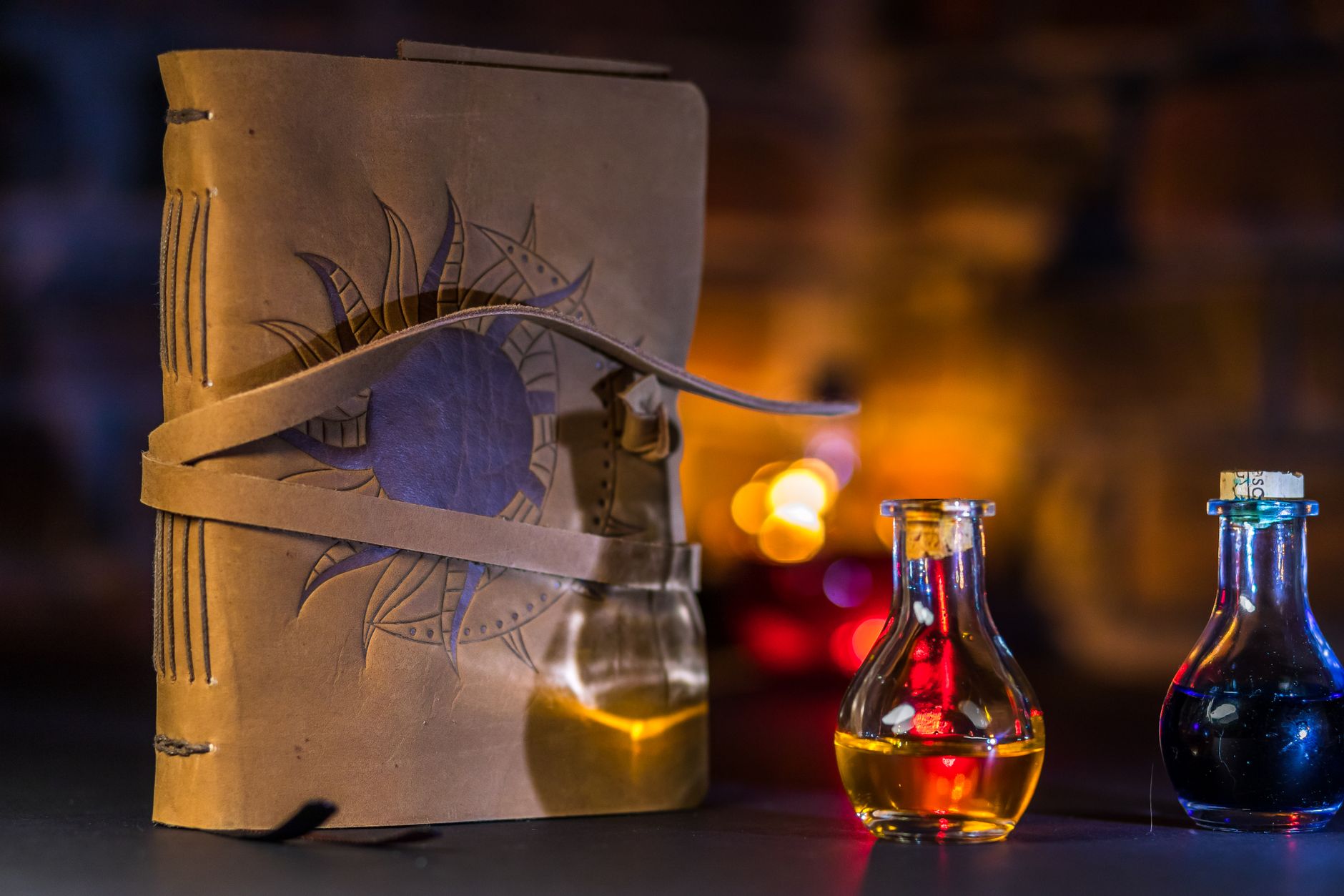 Close-up of a fantasy spellbook and colorful potion bottles creating a magical ambiance.