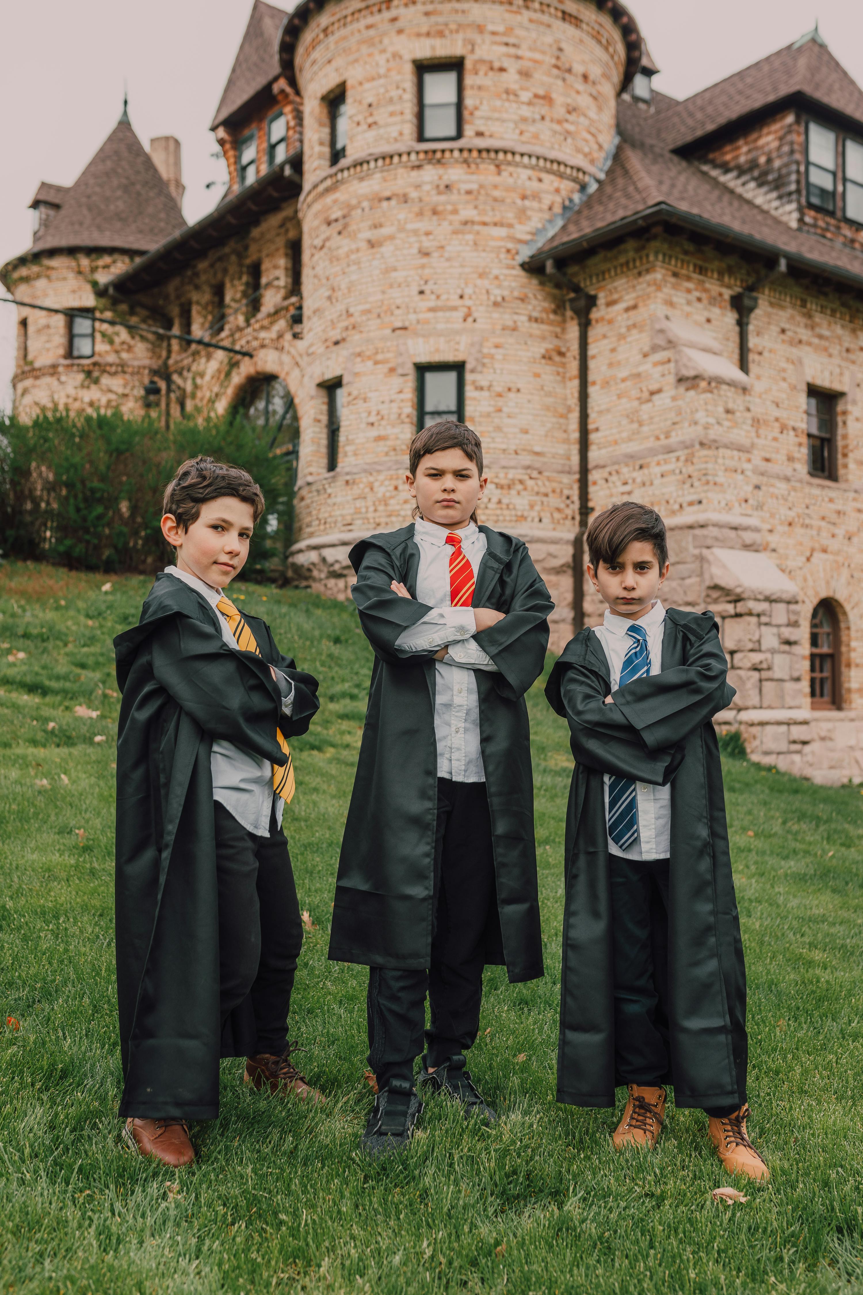 boys wearing harry potter cloak