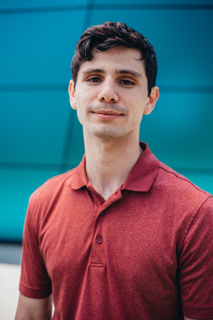 Man In Red Polo Shirt Smiling