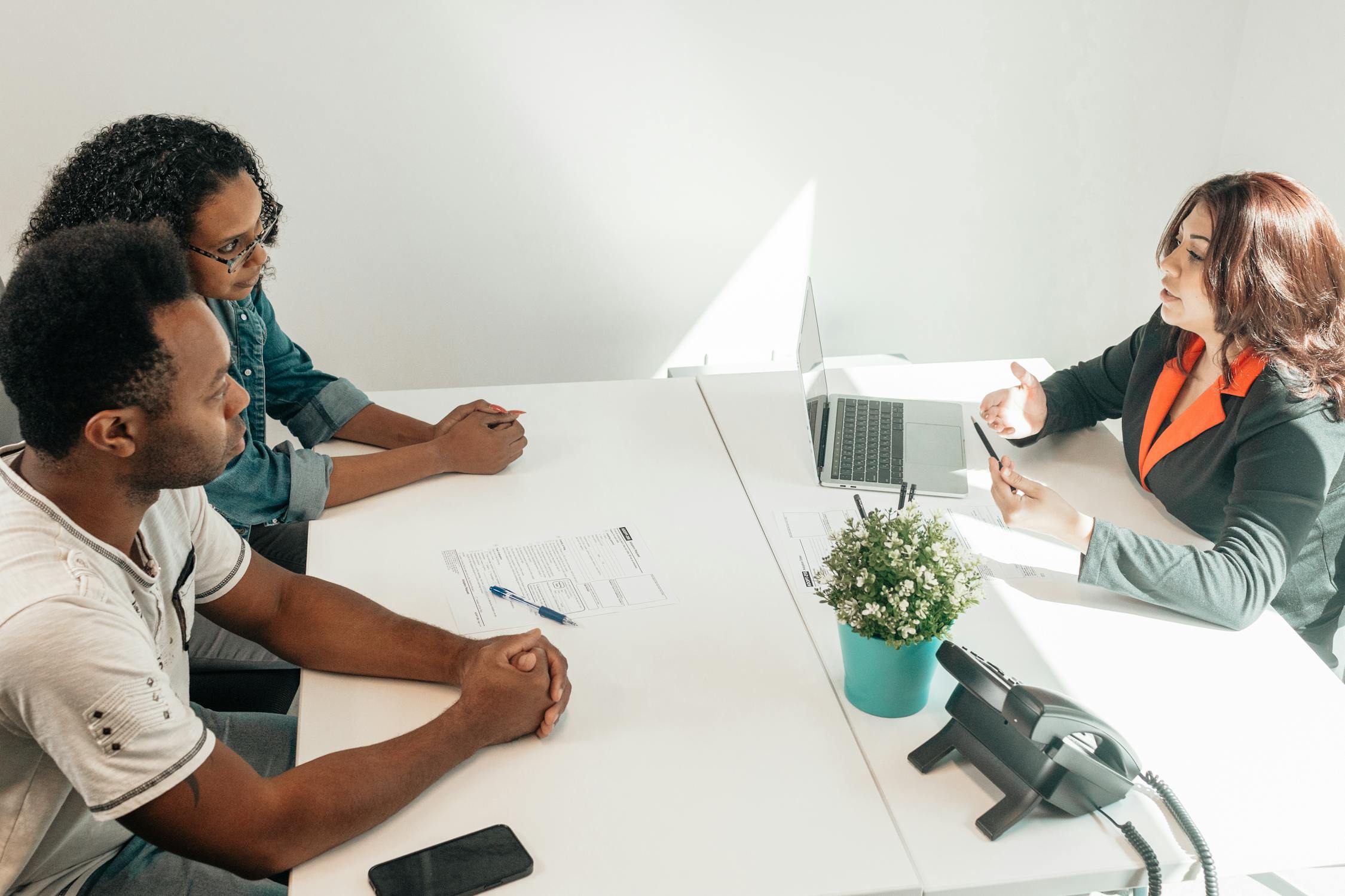 Couple consulting with a wills and estate lawyer