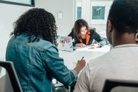 People Writing on Documents