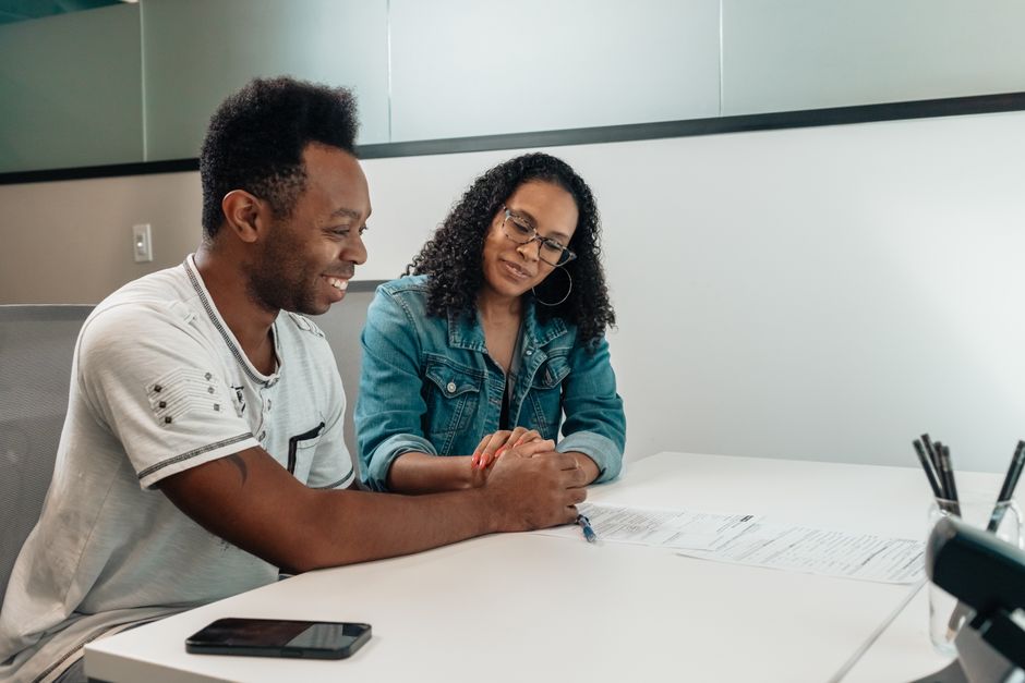 couple looking relieved while reviewing a financial plan - retirement case studies couple looking relieved while reviewing a financial plan - retirement case studies