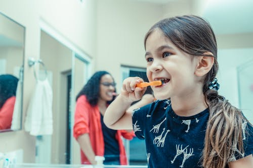 Free A Kid Brushing Her Teeth Stock Photo