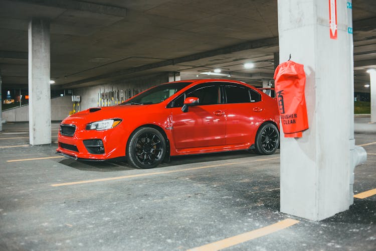 A Car Parked In A Covered Parking Lot