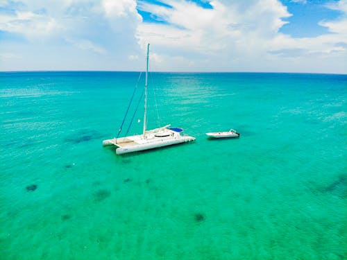 Boats Sailing in Turquoise Water 