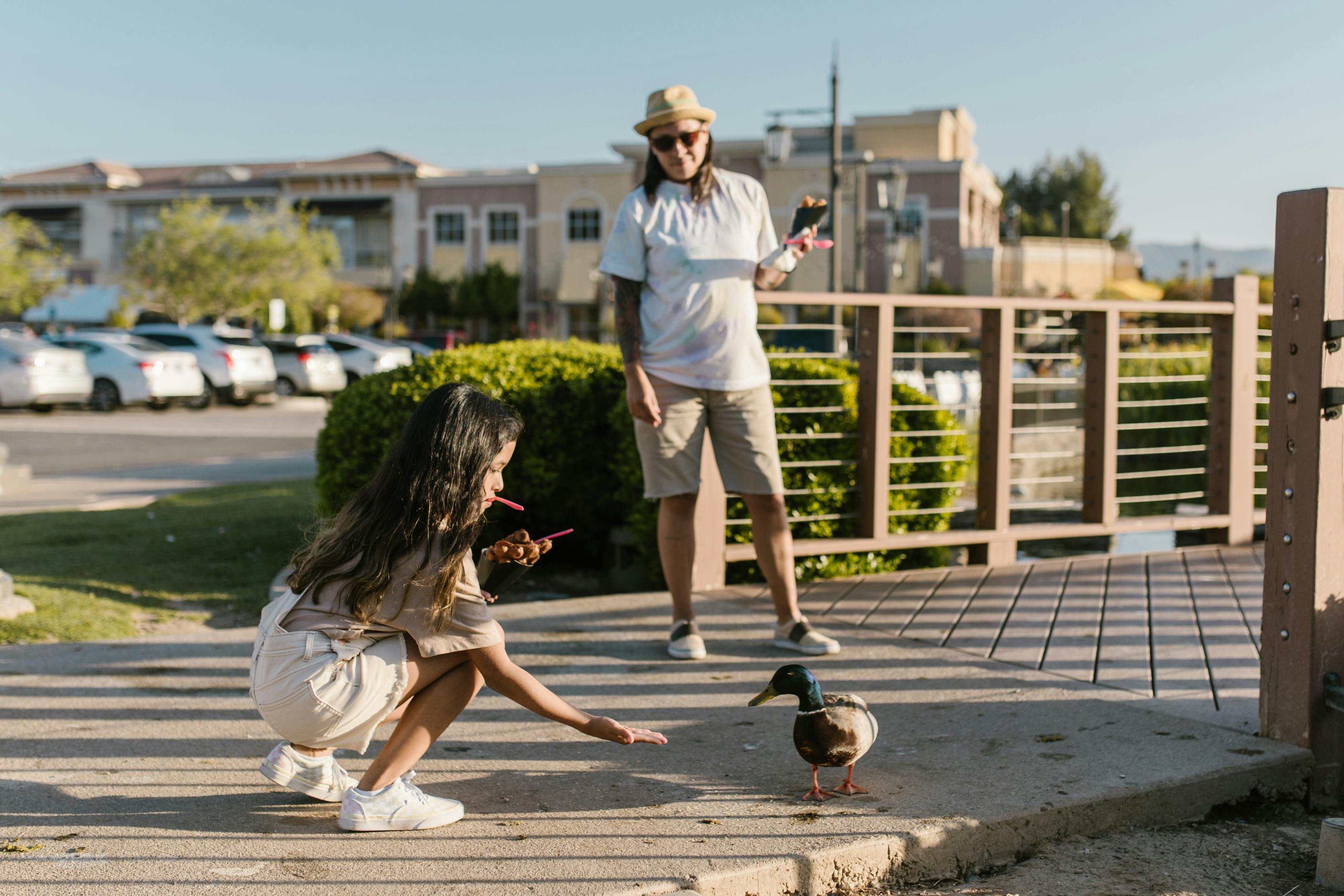 A Girl Feeding a Wild Duck