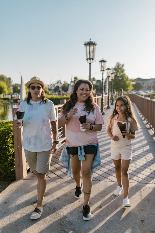 Two Women Walking with Young Girl