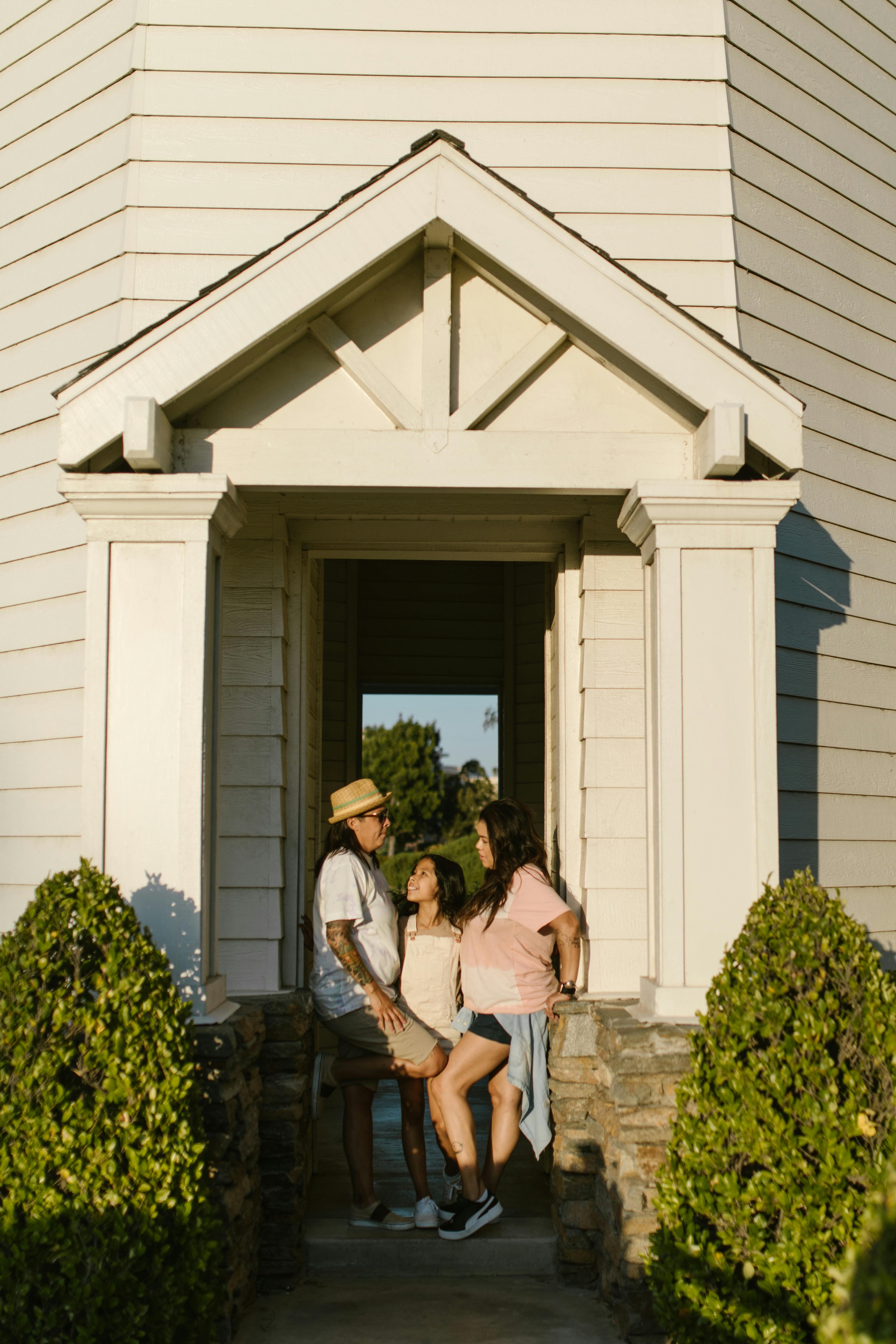 a family standing in the doorway