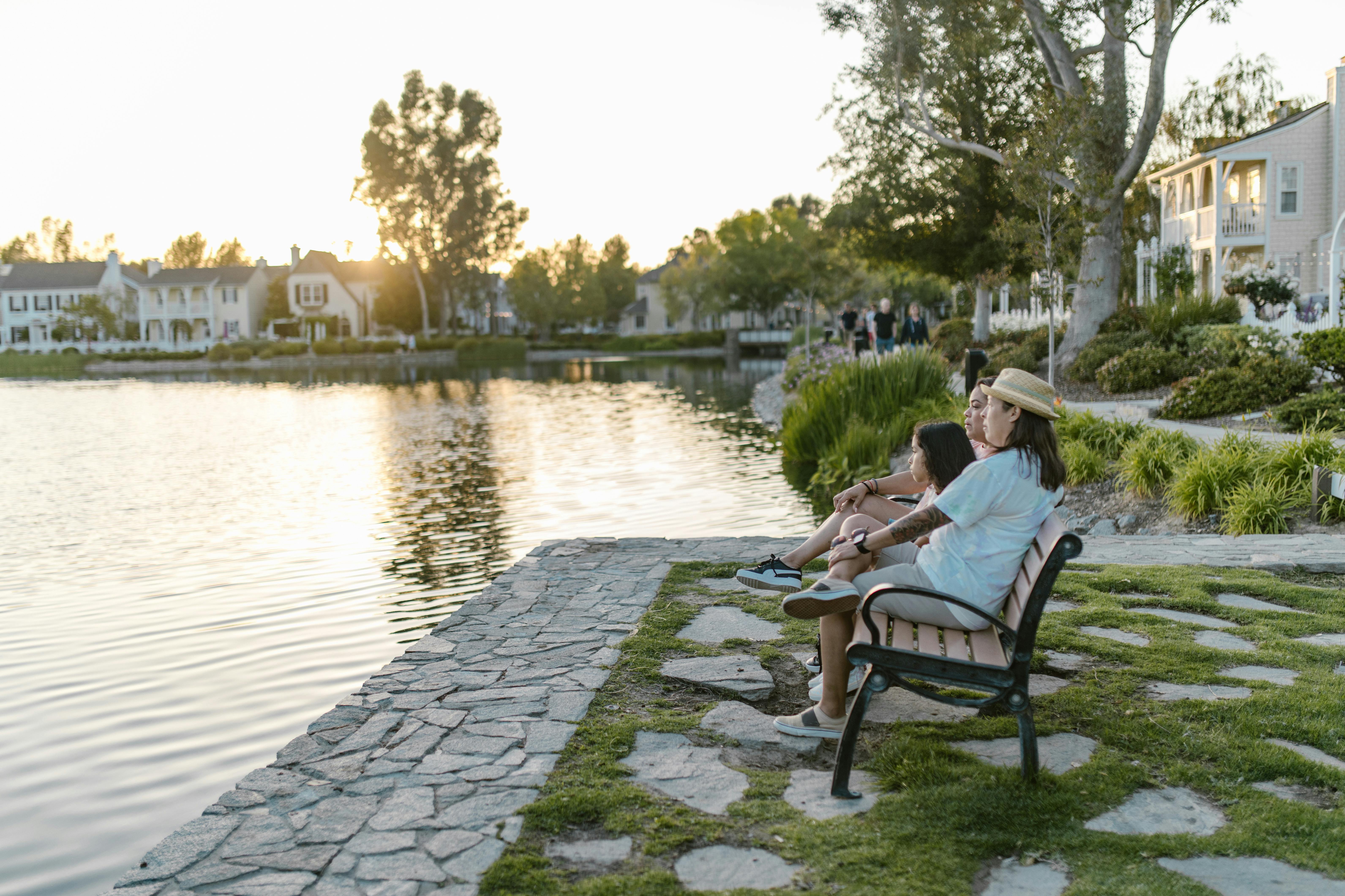 side view of a family sitting on the bench