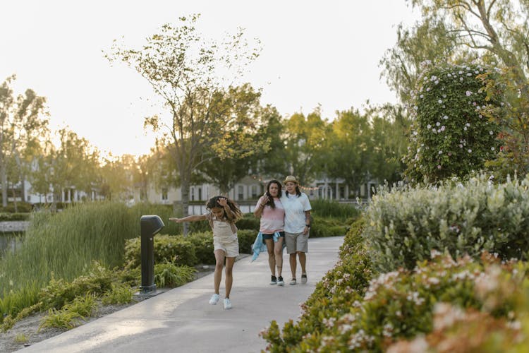 Family Walking On The Pathway