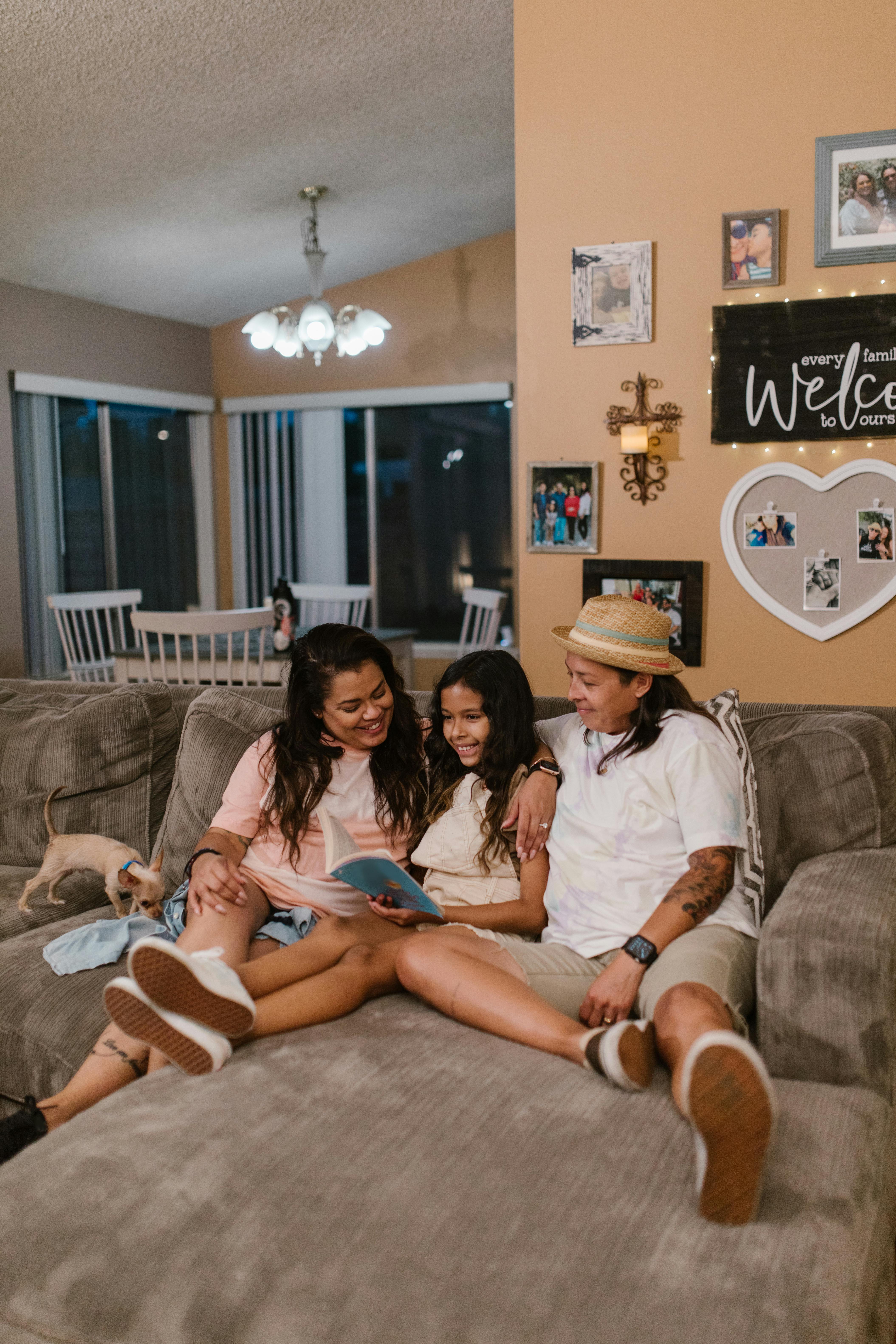 a happy family sitting on the couch while having conversation