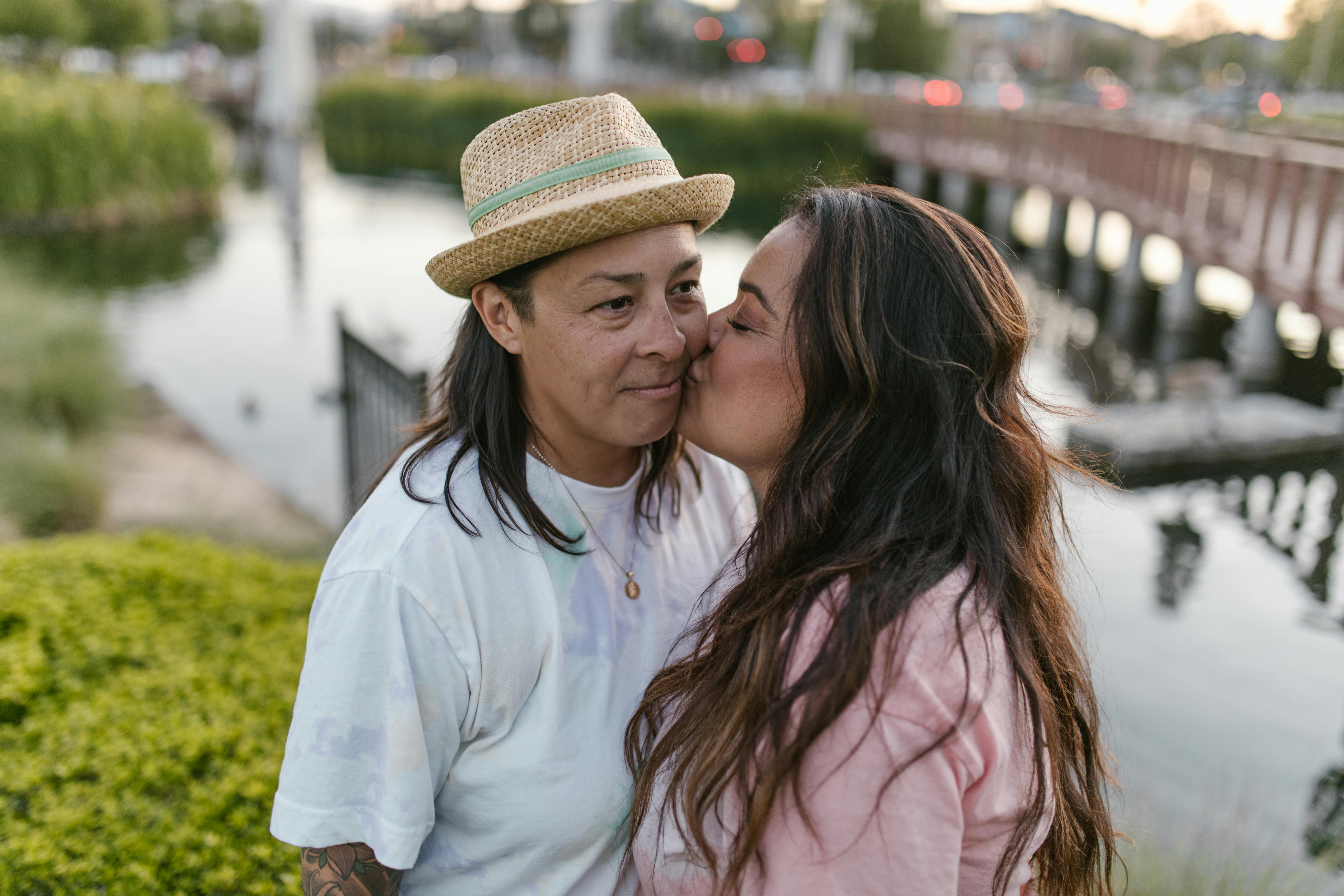 a same sex couple kissing each other