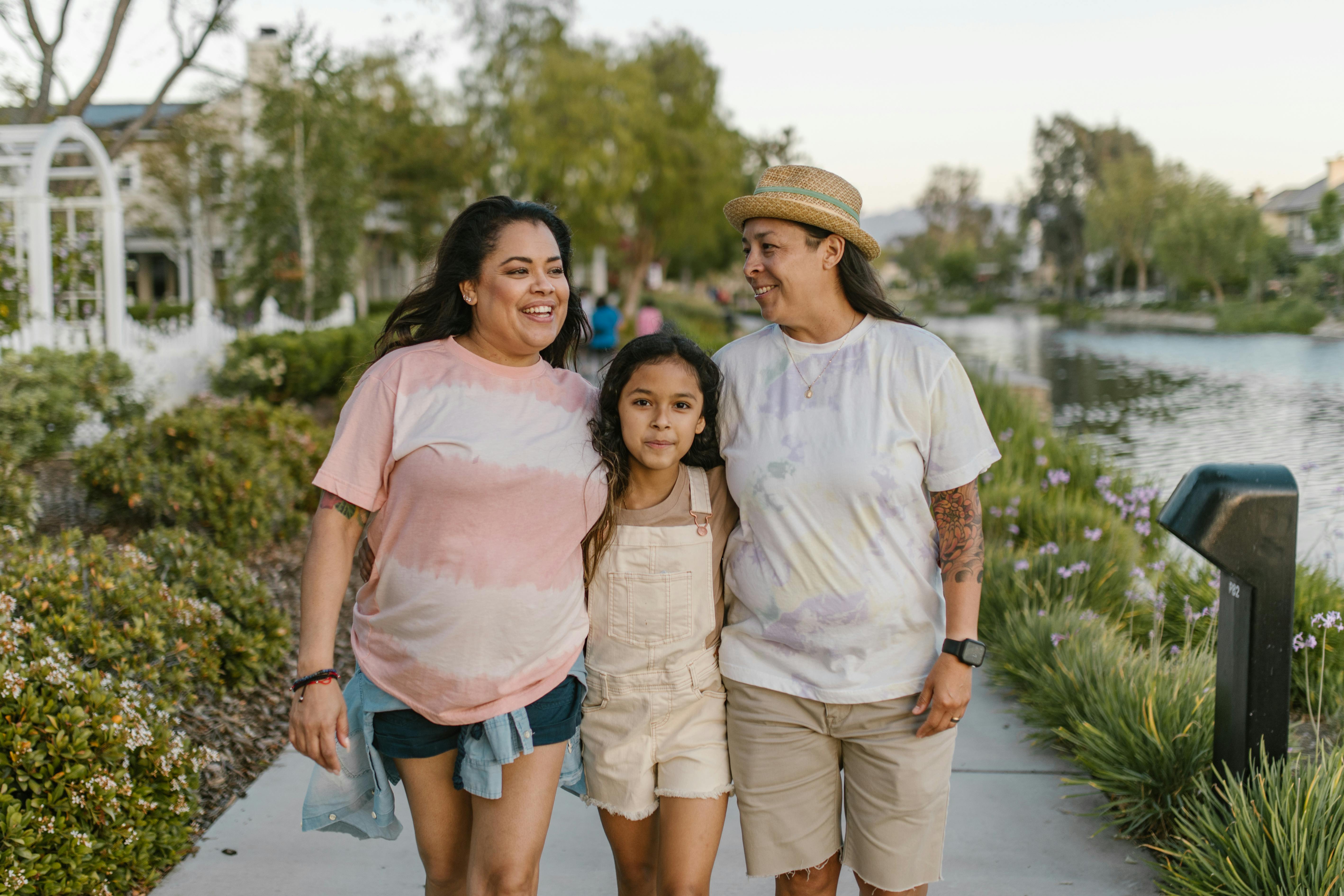 a happy family walking at the park while having conversation