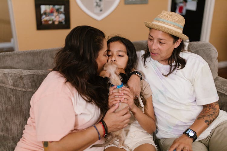 A Family Petting Their Pet