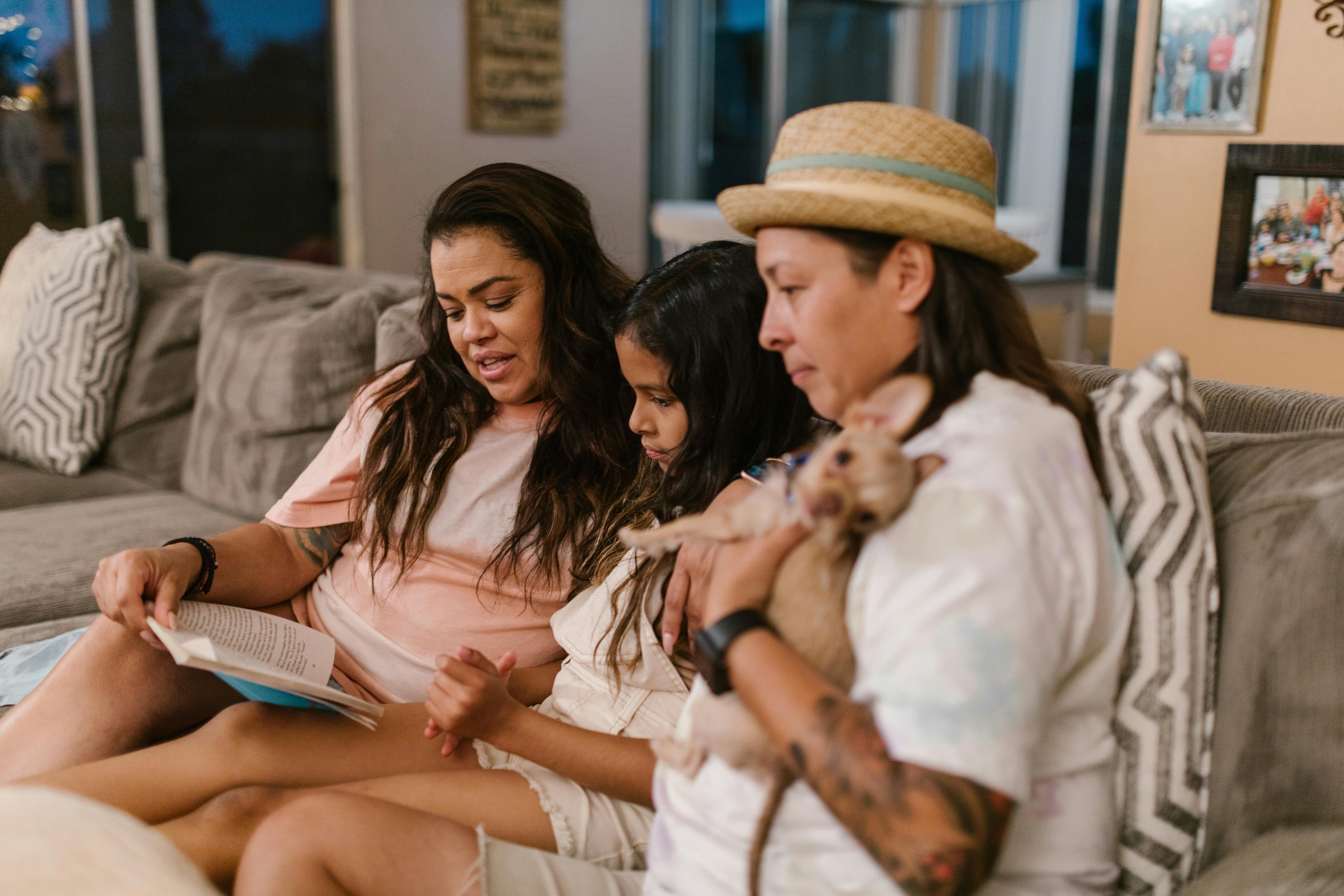 a happy family sitting on the couch while having conversation