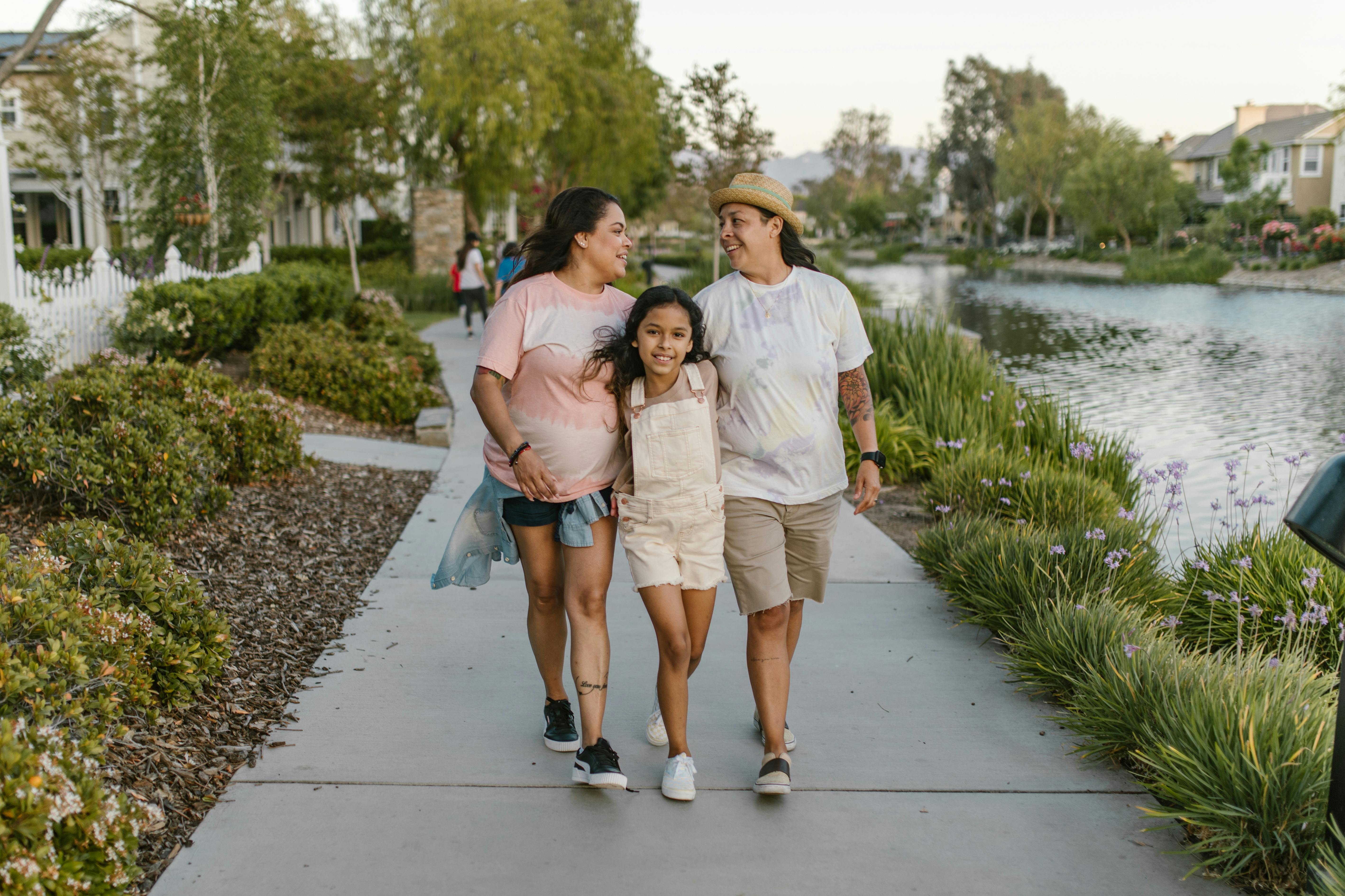 a family walking near a lake