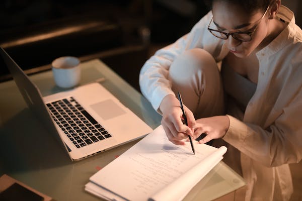 a girl with glasses studying