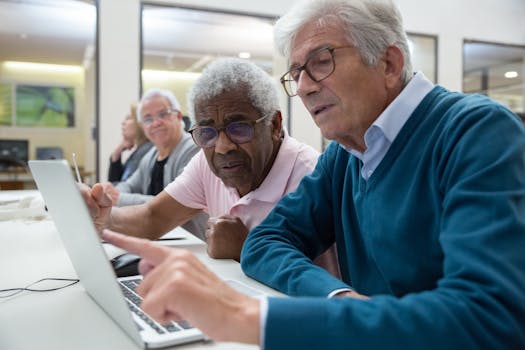Senior adults collaborating and learning technology in a modern indoor setting.