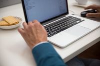 Writing outreach email on a laptop, photo by Kampus Production on Pexels